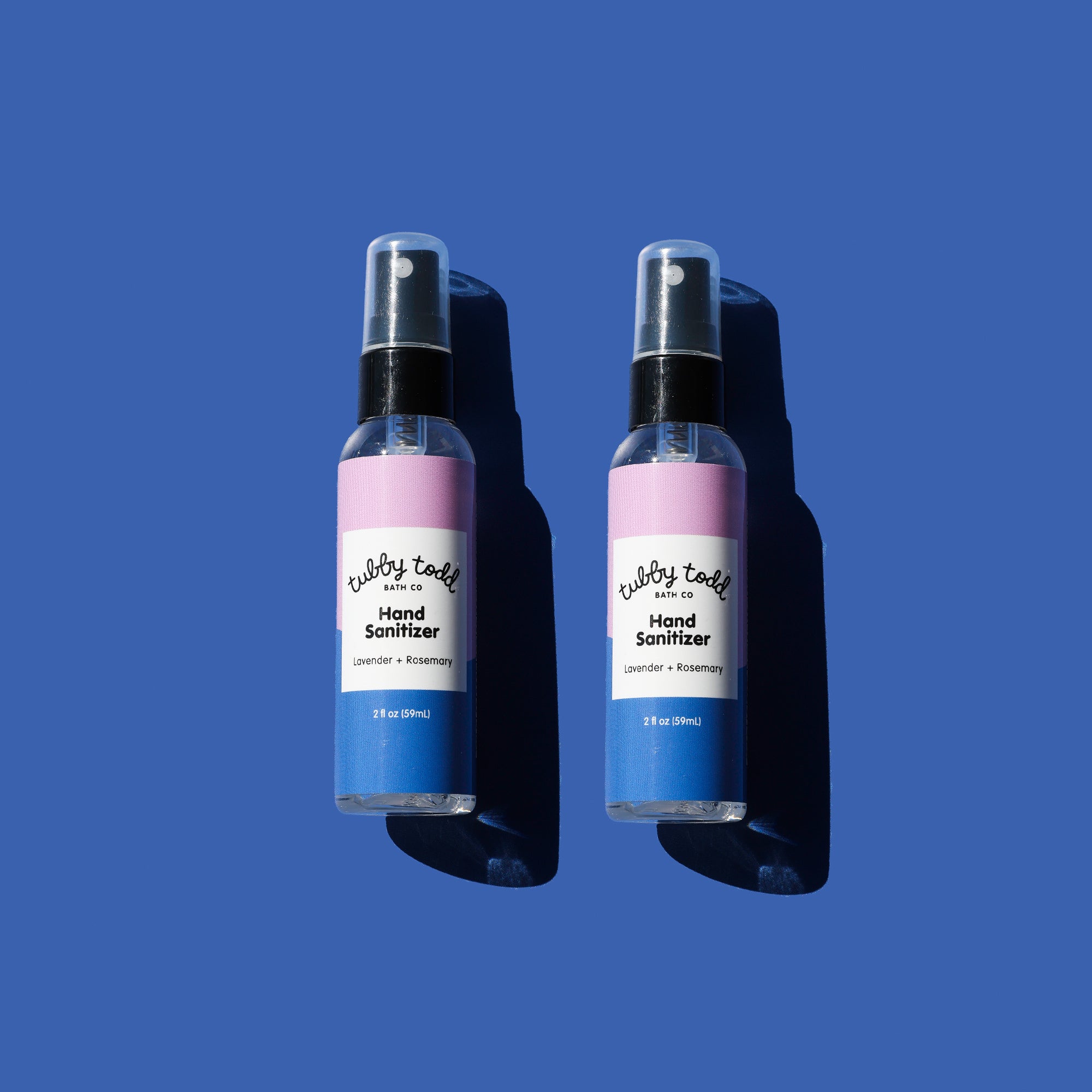 Two bottles of hand sanitizer with a blue background